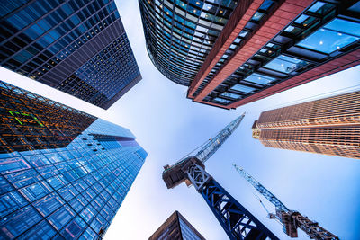 Low angle view of modern buildings against sky