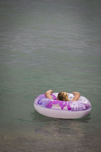 High angle view of women relaxing in lake