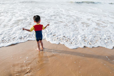 Full length of boy on beach