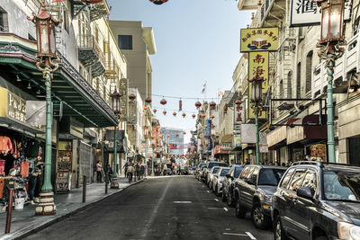 City street amidst buildings against sky