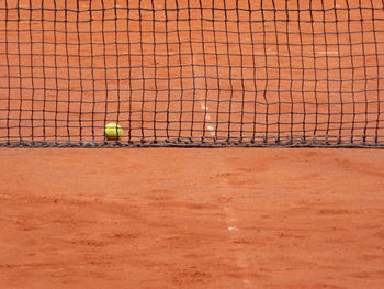 Ball and net at tennis court 