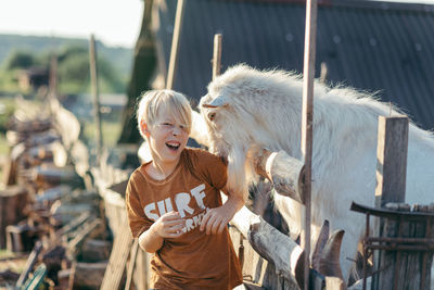Countryside. boy and goat 