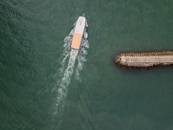 High angle view of ship sailing in sea