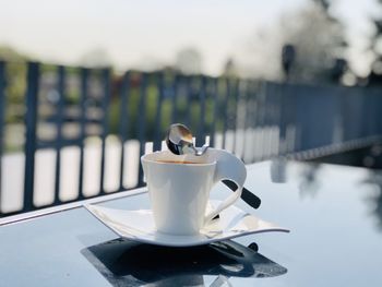 Close-up of coffee cup on table