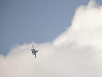 Low angle view of airplane flying in sky