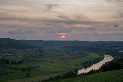 Scenic view of landscape against sky during sunset