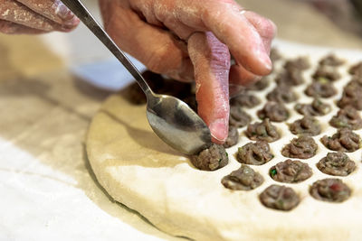 Close-up of person preparing food