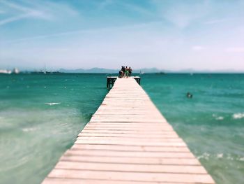 Pier over sea against sky