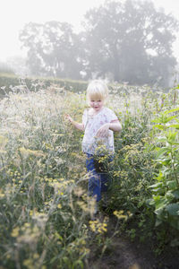 Girl standing on field