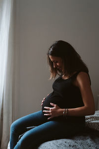 Pregnant woman resting at home