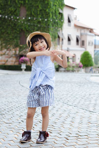 Full length portrait of a smiling girl