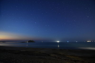 Scenic view of sea against sky at night