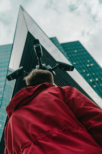 Rear view of man against sky