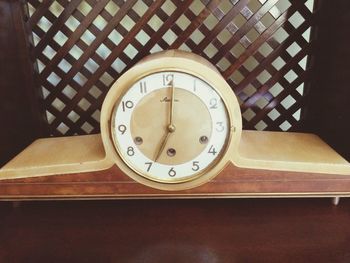 Directly above shot of clock on table
