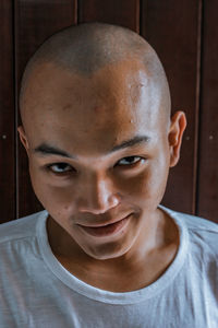Close-up portrait of smiling young man