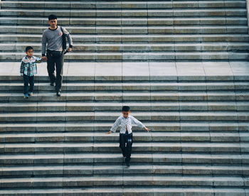 Full length of a man walking on staircase