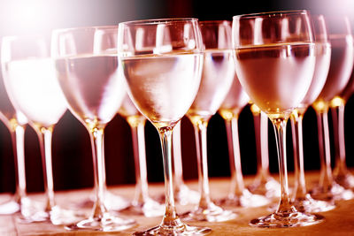 Close-up of wine glasses on table