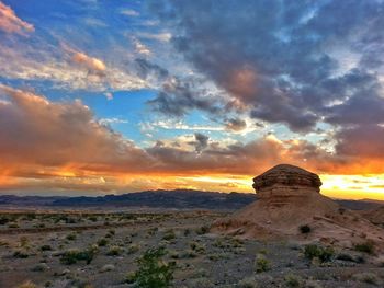 Scenic view of landscape against cloudy sky