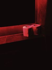 Close-up of red rose over black background