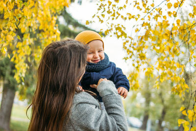 Happy mother and son in park