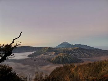 View of volcanic landscape against cloudy sky