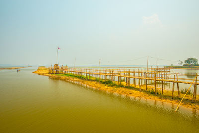 Pier over sea against sky