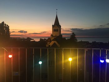 Illuminated building against sky at night