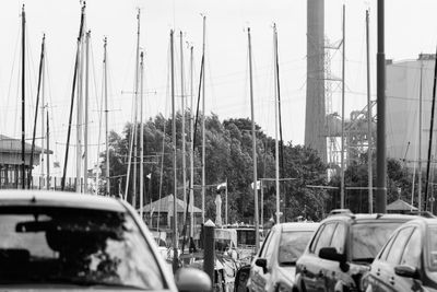 Cars in city against sky