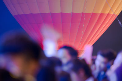 Blurred people against hot-air balloon