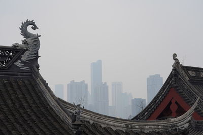 Panoramic view of statue of buildings against clear sky