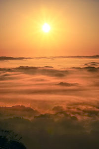 Scenic view of dramatic sky over sea during sunset