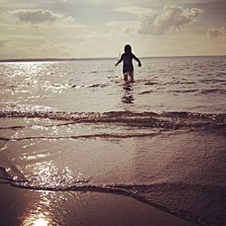 Scenic view of beach at sunset