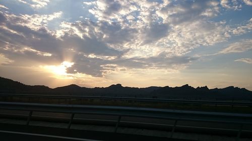 Scenic view of mountains against sky at sunset