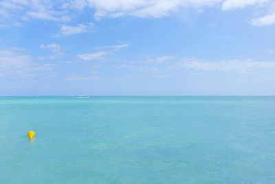 Scenic view of sea against blue sky