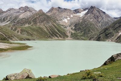 Scenic view of lake and mountains against sky