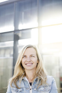 Smiling young woman looking away