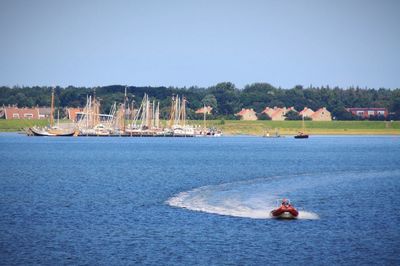 Boat on lake against sky