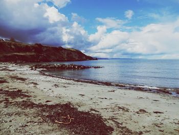 Scenic view of beach against sky