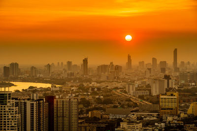 Cityscape against sky during sunset