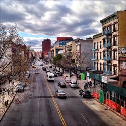 City street against cloudy sky