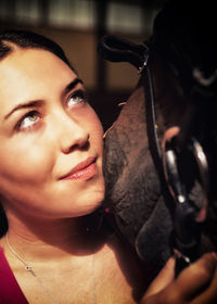 Close-up portrait of young woman looking away