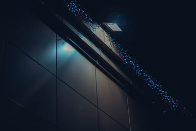 Low angle view of illuminated building against sky at night