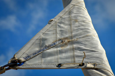 Low angle view of canvas against blue sky