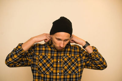 Portrait of man against wall