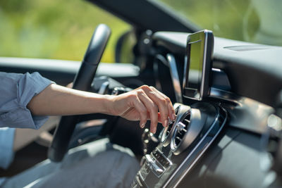 Cropped hand of man repairing car