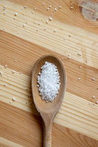 Sea salt on wooden spoon