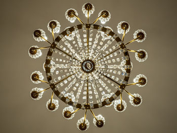 Directly below shot of chandelier hanging from ceiling