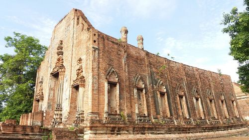 Low angle view of old temple against sky