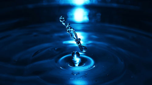 Close-up of drop falling in water