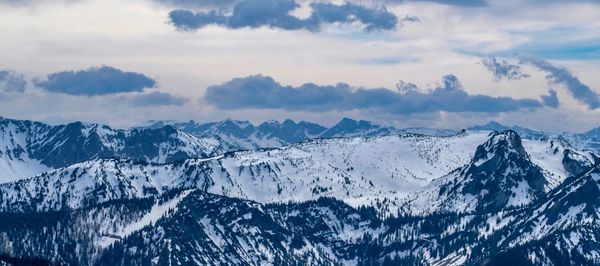 Scenic view of snowcapped mountains against sky